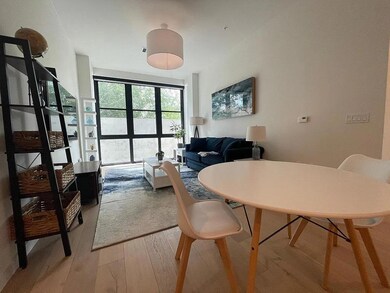 Dining area with light wood-style floors