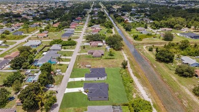 Aerial overview of property's location featuring nearby suburban area