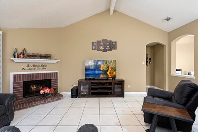 Living room leads to master bedroom.