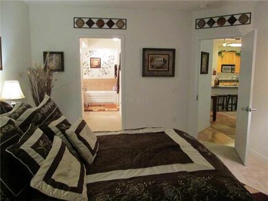 Large Master Bedroom With Windows Overlooking Fron