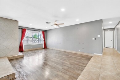 Unfurnished living room with baseboards, visible v