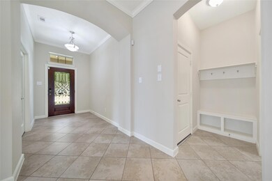 Welcome home through a stylish tiled foyer featuri