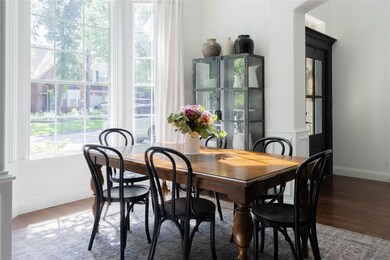 Beautiful two story windows flooding the room with natural light, bringing the outside in!