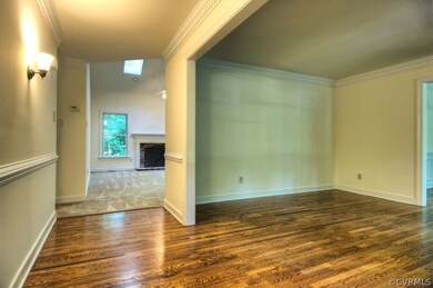 The foyer opens up into the formal living room wit