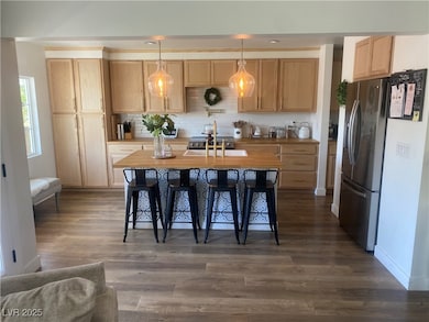 Kitchen featuring stainless steel refrigerator wit