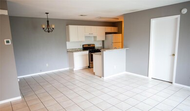 Kitchen featuring stainless steel gas stove, free