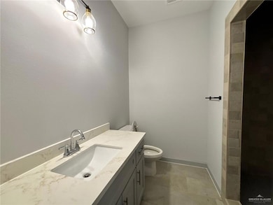 Bathroom with vanity and toilet