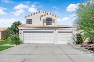 Mediterranean / spanish house featuring a tiled roof, stucco siding, concrete driveway, and an attached garage