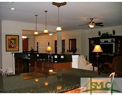 Kitchen. THIS IS LOOKING FROM THE BREAKFAST BAR TO