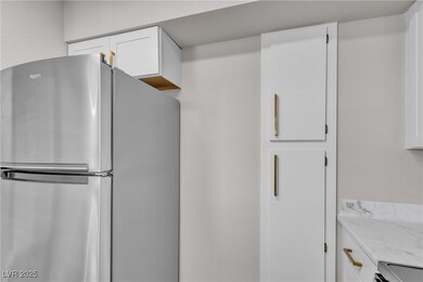 Kitchen featuring stainless steel appliances, a si