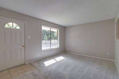 Tiled entrance foyer and Living Room featuring a t