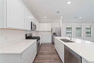 Giant island kitchen with quartz counters, ample c