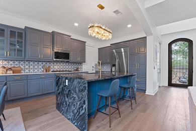 Kitchen featuring visible vents, appliances with 