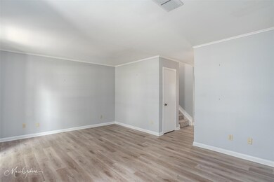 Empty room with light wood-type flooring and ornam