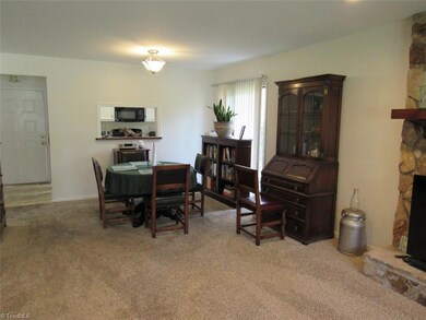 combination dining room and living room.  with a pass thru to the kitchen.  You also have smooth ceilings.
