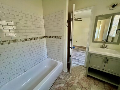 Full bathroom with vanity and tub / shower combin