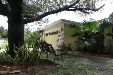 Well maintained home with tropical plantings and m