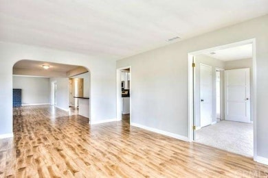Living room leading to dining and kitchen.