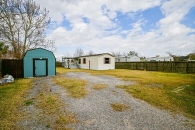 View of Mobile home from back Main house