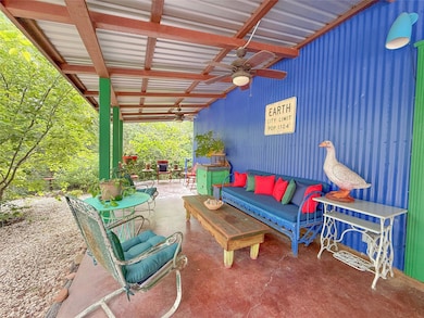 View of patio with a ceiling fan