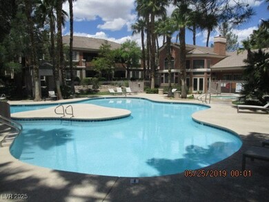 Community pool featuring a patio area