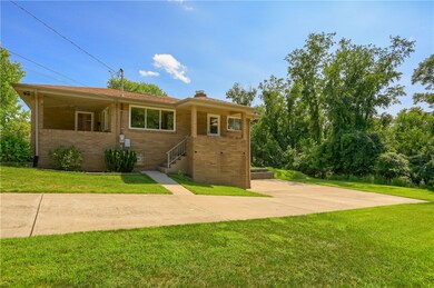 This view shows the large CONCRETE driveway