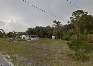 Rear of home showing above ground pool, storage shed, and LARGE fenced back yard.
