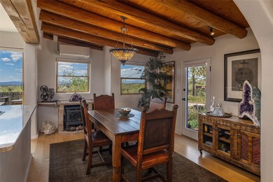 Dining Room with gas fireplace & door to terrace