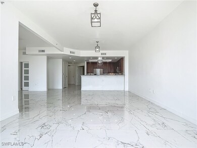 Unfurnished living room with baseboards and light