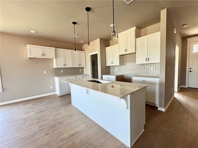 Quartz countertops, walk in pantry and large islan
