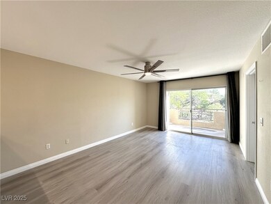 Empty room with wood finished floors and a ceiling