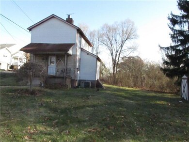 Large side yard with shed.