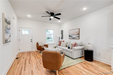 Living room with hardwood / wood-style floors and