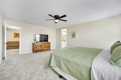 Bedroom featuring carpet and ceiling fan