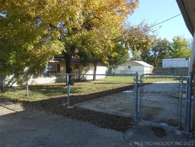 Fully fenced yard with large patio