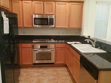 Property Photo. Kitchen with granite counters, nev