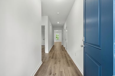 Wide entry hall with LVP.