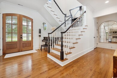 Entrance foyer with light wood-type flooring, fren