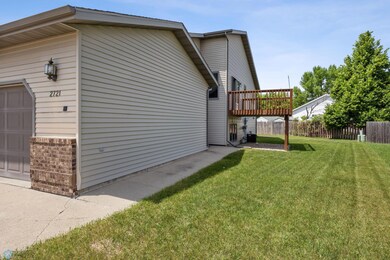 Extra-wide garage, nice deck, & simple landscaping.