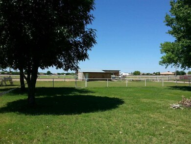 Tack Room/Garage & 4 Covered Stalls