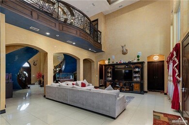 Tiled living room featuring a high ceiling