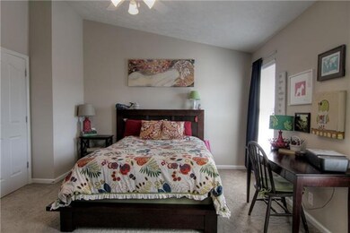 First bedroom with full bath & walk-in closet.