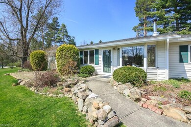 Great entry with stone lined sidewalk and front pa