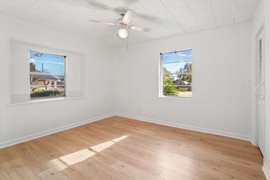 Bedroom 1 downstairs has laminate flooring, a ceil