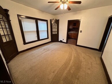 Unfurnished bedroom featuring light colored carpet and ceiling fan