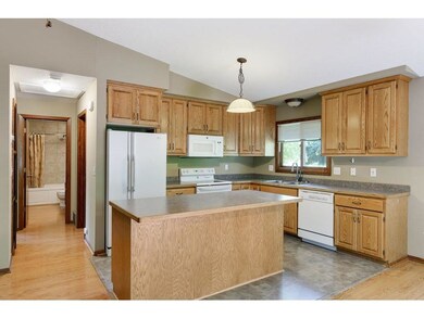 Bright, open kitchen with island for all to surrou