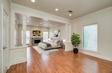Virtually staged spacious primary bedroom with a c