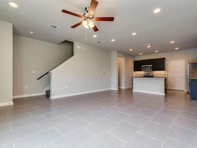 Unfurnished living room with a ceiling fan, light
