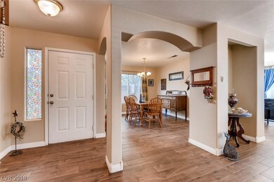 Entry foyer overview of family room and dining roo