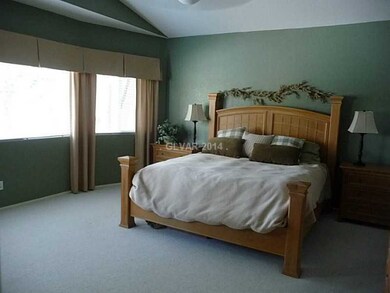 Property Photo. Master bedroom looking out to pool